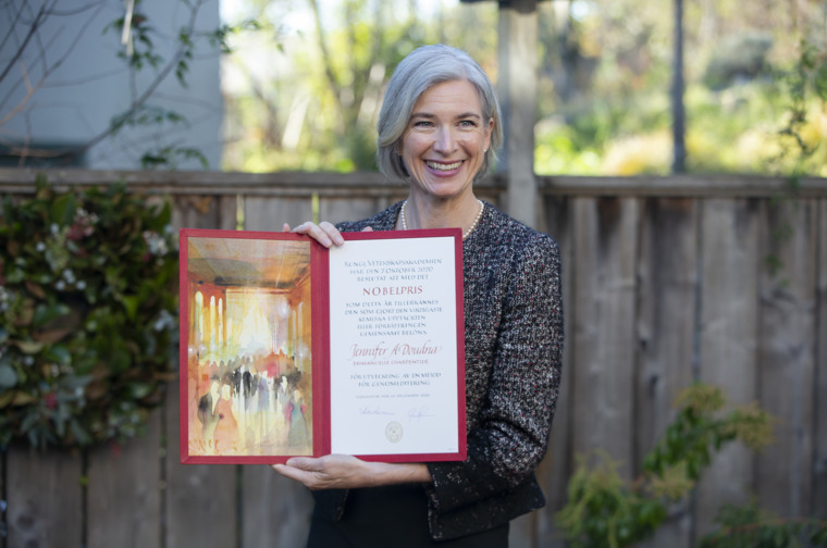 Jennifer A. Doudna showing her Nobel Prize diploma.