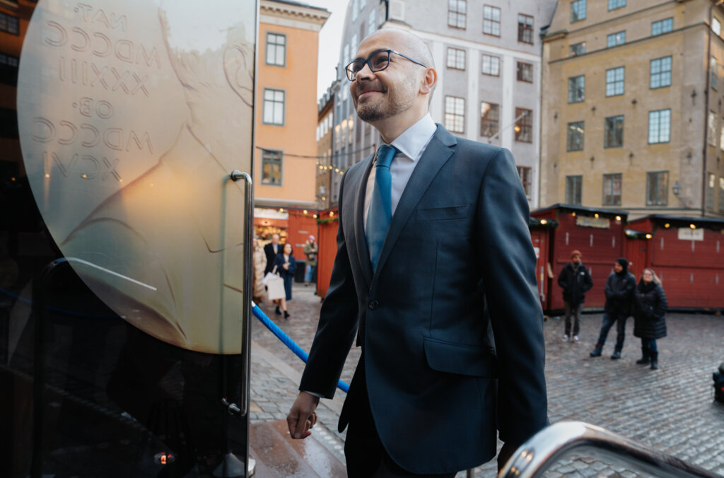 A man entering a door