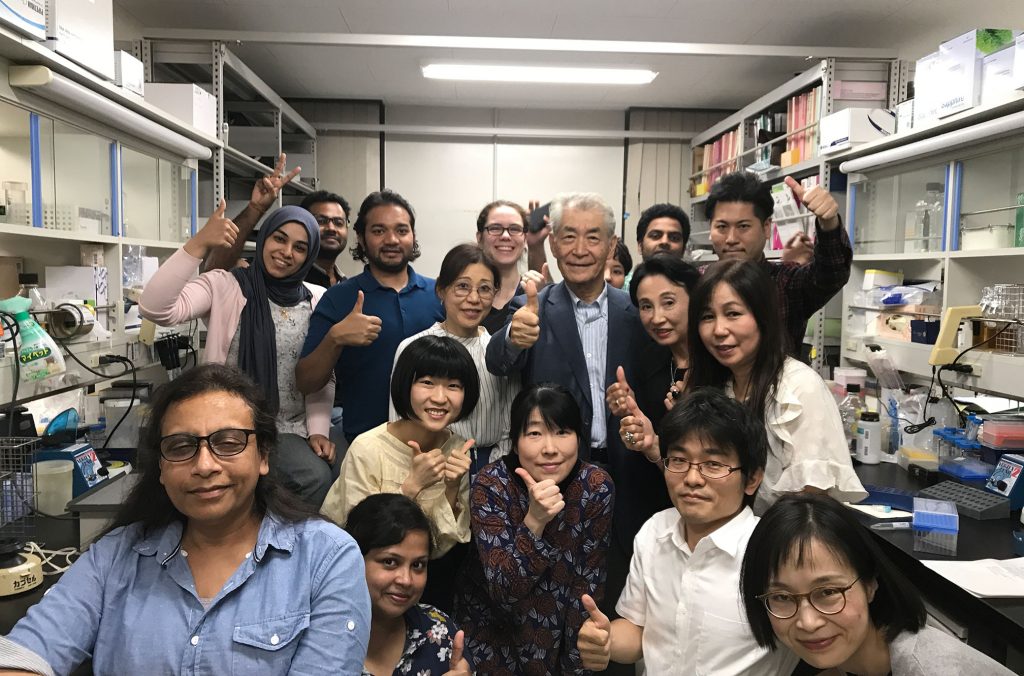Nobel Prize laureate Tasuku Honjo, surrounded by his team at Kyoto University