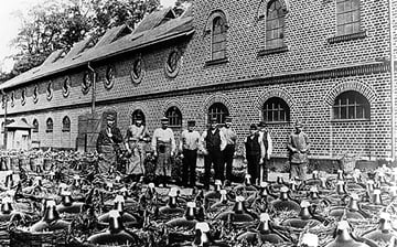 An old factory with its workers outside